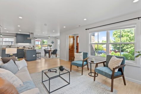 Interior 24th Ave Livingroom, dining room and kitchen looking out on a sunny day 0035 249kb