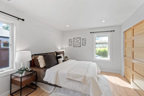 Interior 24th Ave Master Bedroom with sliding wood doors 0070 170kb