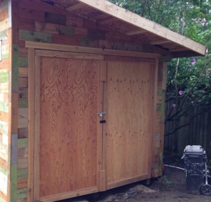 Wood shed with colorful siding