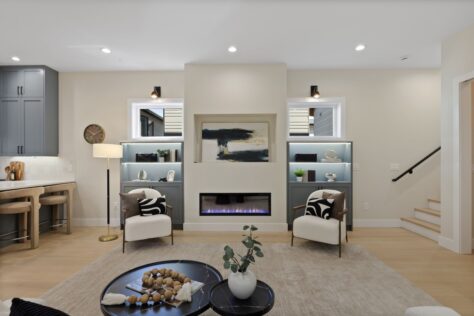 Interior Chapin Living Room with fireplace and edge of kitchen and stairs 0030 173kb