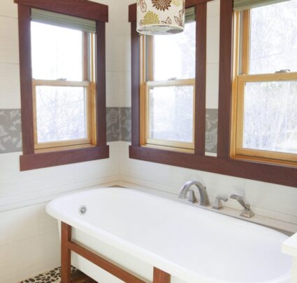 bathroom bath tub with wooden windows