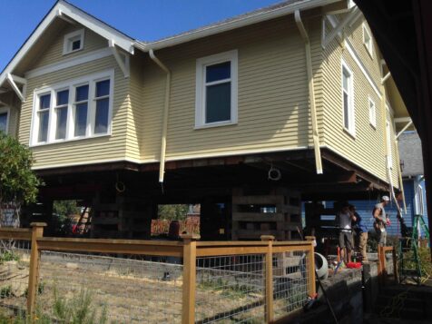 Yellow house up on piers